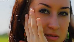Charming brunette with a perfectly shaved pussy likes to masturbate in the nature, during the day