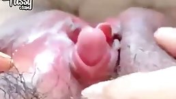 Horny, Japanese babe with hairy pussy is gently touching her perky clit, in front of the camera