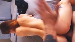 Tattooed babe with natural tits and curly hair is moaning while getting fucked from the back