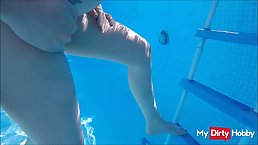 Woman with big boobs and pierced nipples is getting fingered and fucked in the swimming pool