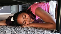 Exotic teen brunette with a beautiful smile is giving a footjob to a guy she likes