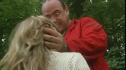 Great looking blonde lets a stranger touch her pussy and sucks his cock, in the forest