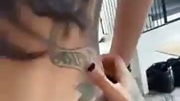 Tattooed brunette with beautiful, blue eyes is giving a blowjob to a friend, before getting fucked