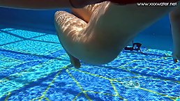 Curvaceous, Latin brunette, Andreina De Luxe likes to touch her pussy while in the swimming pool