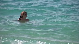 Naked girls are relaxing on a local nudist beach or even having a beauty nap