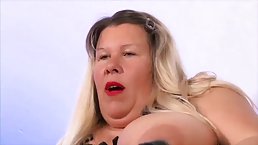 Busty German plumper with blonde hair is doing everything she can think of to please a man