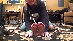 Naughty woman gets super horny while gently licking feet and sucking toes on the floor