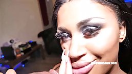 Hot chocolate brunette, Cokaine Staxxx is kneeling on the floor while sucking a rock hard cock