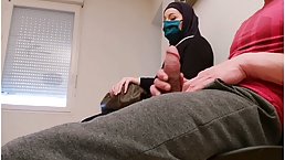 Muslim woman is giving a handjob to a random, horny man, in front of a hidden camera