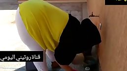 Arabic woman isn't aware that a kinky neighbor is staring at her big ass, all day long