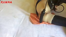 Chick in latex stockings is using a massive dildo and moaning from pleasure while doing it