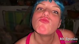 Insatiable babe with blue hair is kneeling on the floor while sucking her neighbor's dick
