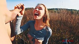 Frisky girl is sucking her best friend's dick in the nature, in the late afternoon