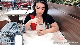 Lovely brunette, Emanuelly Gozando has a vibrator inside her pussy while in a public place