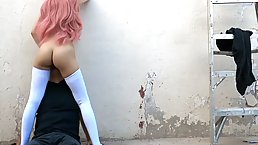 Babe with pink hair is moaning while getting her pussy licked in a public place