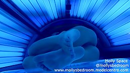 Lovely girl is masturbating in the solarium and trying not to moan during an intense orgasm