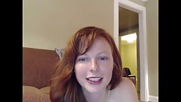 Small titteed redhead is taking off her clothes in front of the camera, for the first time