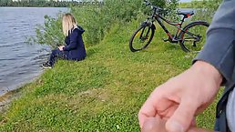 Horny guy was jerking off near a charming blonde babe, who was enjoying in the nature