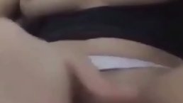Naughty girl is about to start masturbating in front of the camera, just for fun