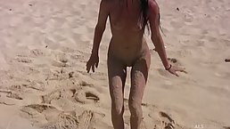 Naked lesbians are eating each other up on the beach, in the middle of the day