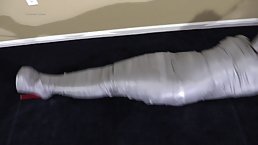 Tempting brunette secretary gets her entire body covered in duct tape, her boss had fun after hours