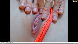 Blonde teen is stretching her labia and tease her entrance with her fingers, for a camere