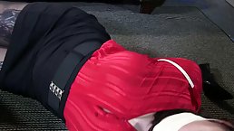 Two pretty hot chicks are squirming while they were suspended and tied down on the floor 
