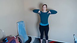 Red haired woman is often uploading online workout classes, because it excites her to make them