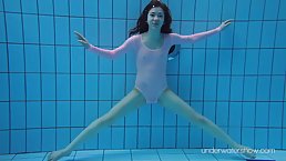 Slim, gymnast babe with small tits, Roxalana is doing naughty stuff in the swimming pool