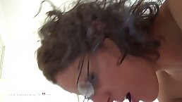 French brunette with glasses is wearing black stockings while sucking dick and getting fucked hard