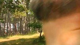 Chubby redhead with big, bouncy boobs is having sex with an older man, in the nature