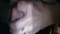 Busty mature, Kim is giving a handjob to her horny lover, in front of the camera