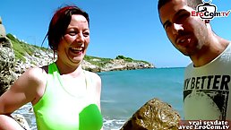 French woman is having casual sex on the beach with a younger guy she has just met