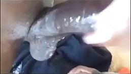 Babe with glasses is sucking a fat, black cock as deep as she can, just for fun