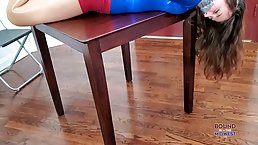 Wonderwoman is about to get tied up by a fake cop and humiliated by a villain