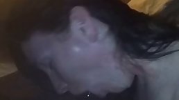 Slutty, Caucasian brunette is sucking a big, black dick in the middle of the night
