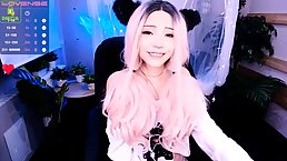 Adorable girl with long, pink hair is about to show us her tiny tits, just for fun