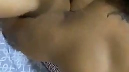 Latin babe with firm tits and tan lines is kneeling on the floor while sucking dick