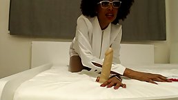 Stunning Ebony babe is sucking a fake dick in front of the camera, just for fun