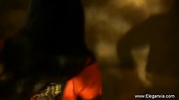 Gorgeous, Indian brunette is dancing and slowly taking off her clothes, in the middle of the night