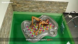 Big titted blonde is masturbating in the middle of the day, with a huge, black dildo