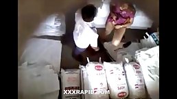 Horny guy was caught by security camera while he was pleasing a woman in the storage room