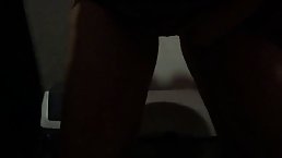 Mature woman is playing with her pussy in a public bathroom and pissing while doing it