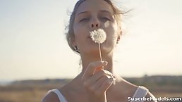 Small titted, blonde teen likes to get naked and masturbate in the nature, during the day
