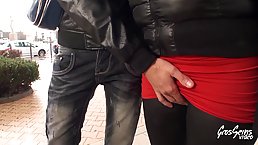 Busty blonde woman with ample curves is having a threesome with guys from the neighborhood