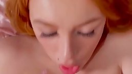 Busty redhead, Lacey Laid is sucking her roommate's hard dick, in the middle of the day