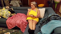 Chubby granny with big, saggy tits is spreading her legs wide open on the couch