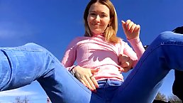 Charming blonde chick is about to be naughty on the beach, in the middle of the day