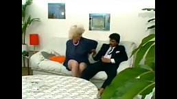Slutty blonde mature, Lyn Armitage is getting doublefucked in front of a friend, who is masturbating