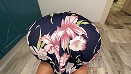 Mature woman in a floral dress is getting fucked from the back, in the kitchen